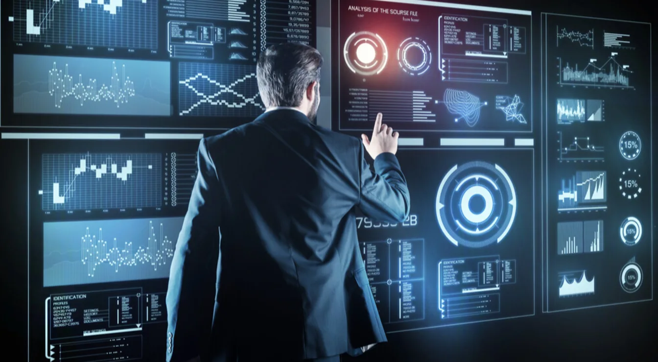 Cybersecurity professional working with Microsoft Defender XDR unified security console, showing threat detection dashboards, security alerts, incident investigation workflows, and automated response capabilities